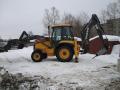 Экскаватор-погрузчик Volvo BL71 с гидромолотом